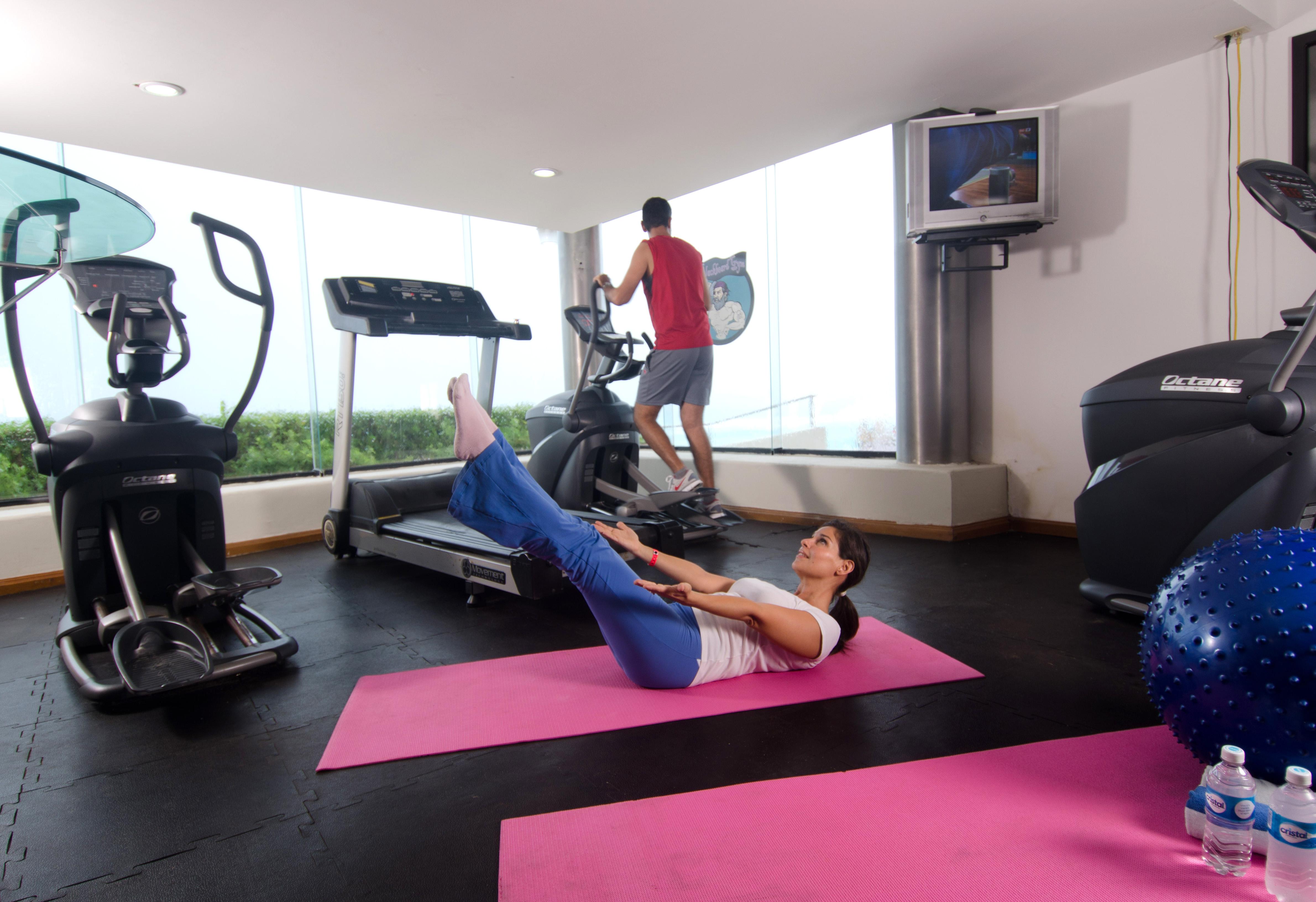 Crown Paradise Club Cancun Exterior photo A woman doing sit-ups